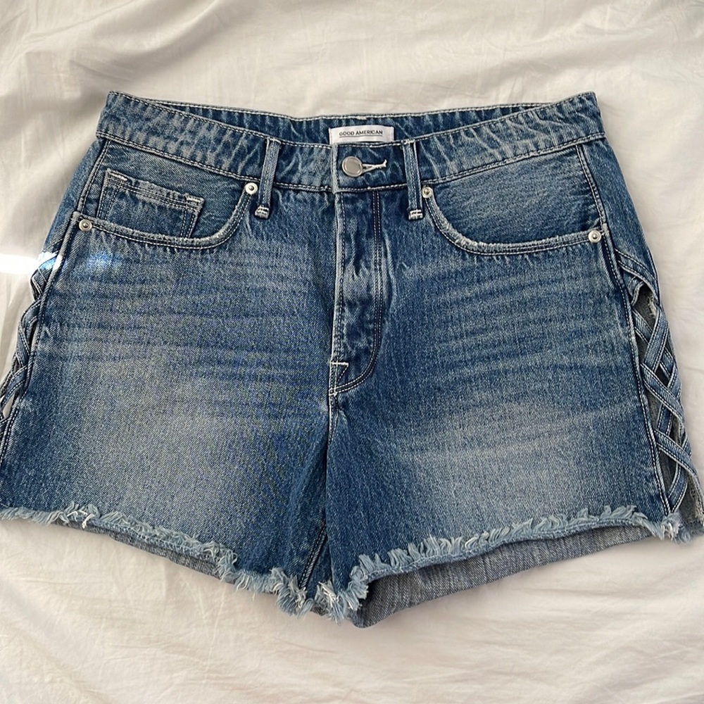 Good American raw gem cross cross side denim shorts